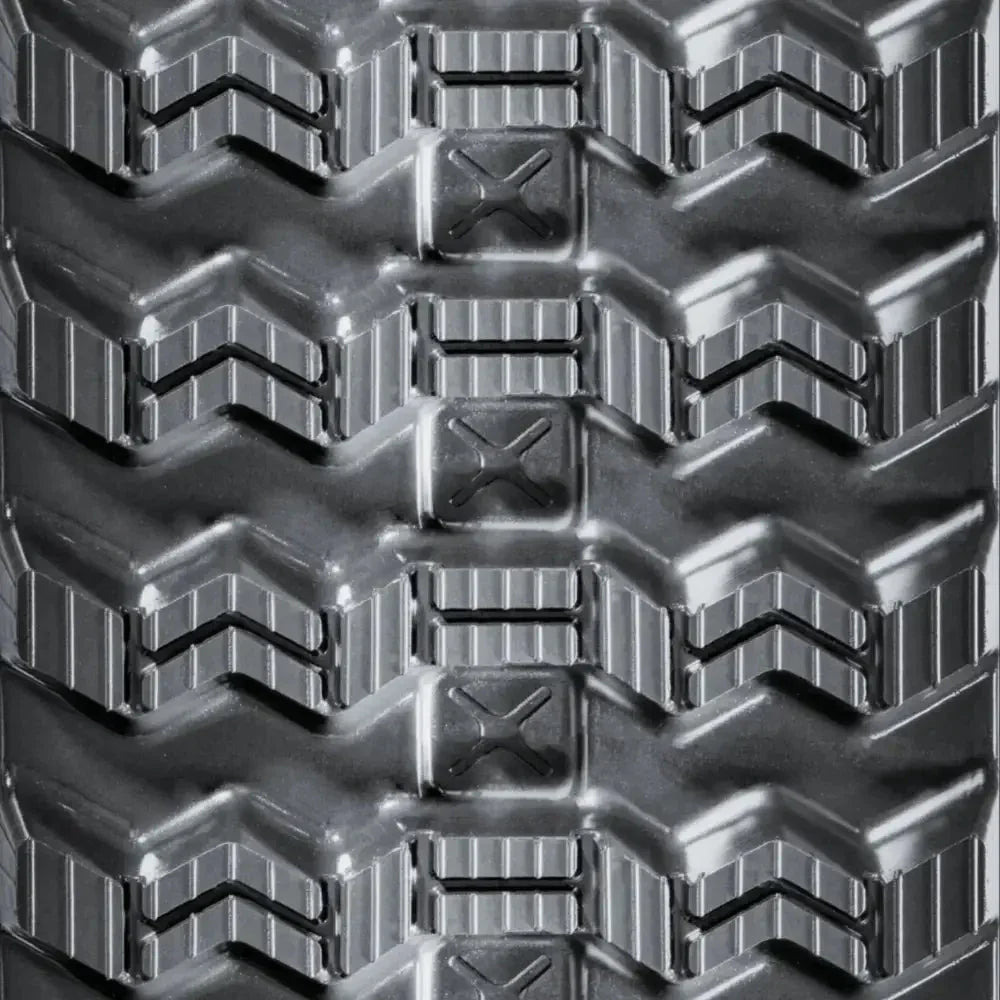 Close-up of BOBCAT T770 rubber track with chevron and rectangular lugs for traction