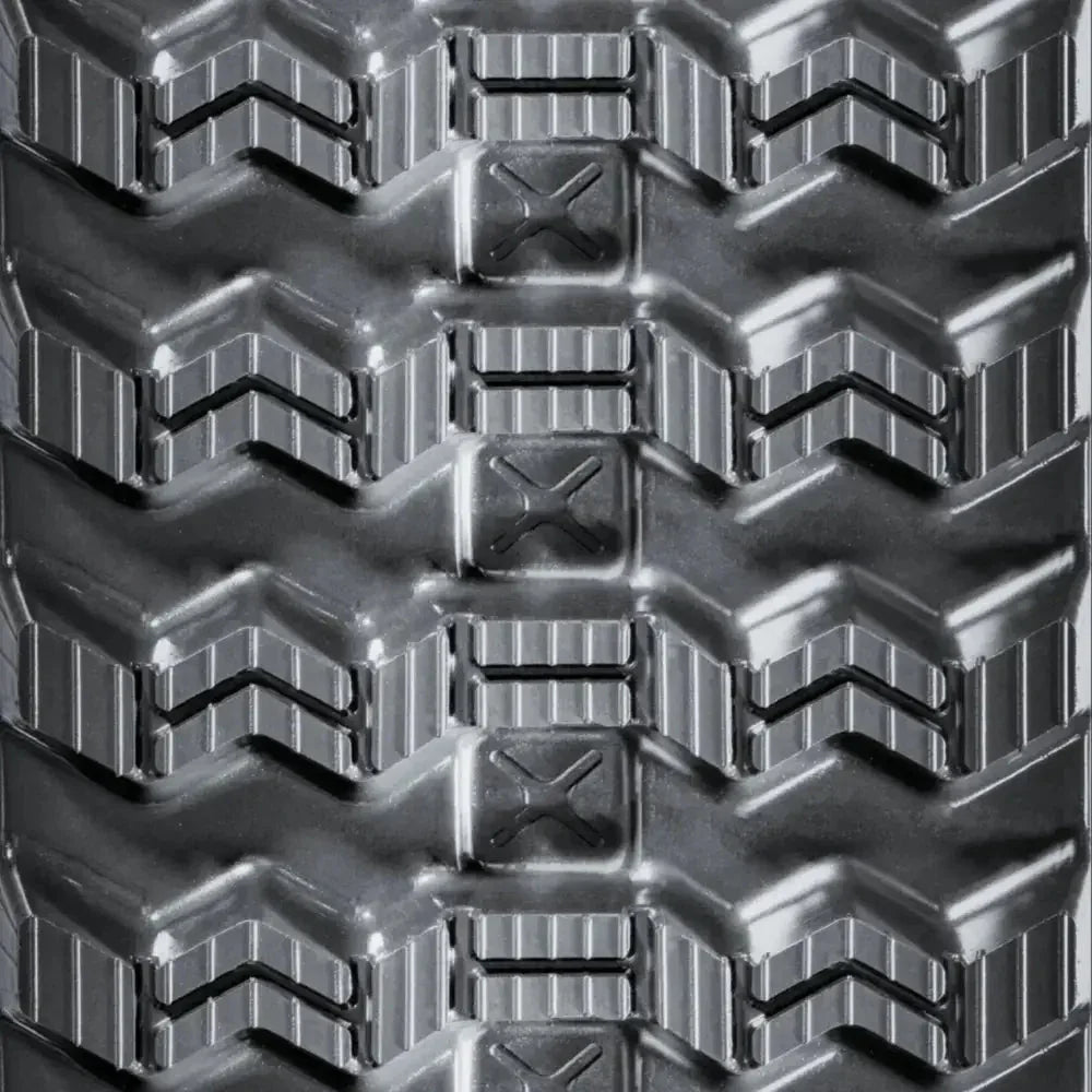 Close-up of CASE TR310 heavy-duty tire tread with chevron patterns and rectangular blocks