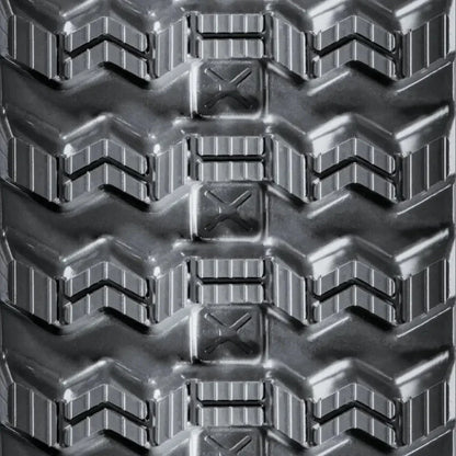 Close-up of CASE TR310 heavy-duty tire tread with chevron patterns and rectangular blocks