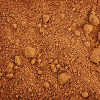Smooth, level dirt, showcasing the clean finish left by zig-zag track treads, ideal for final grading.