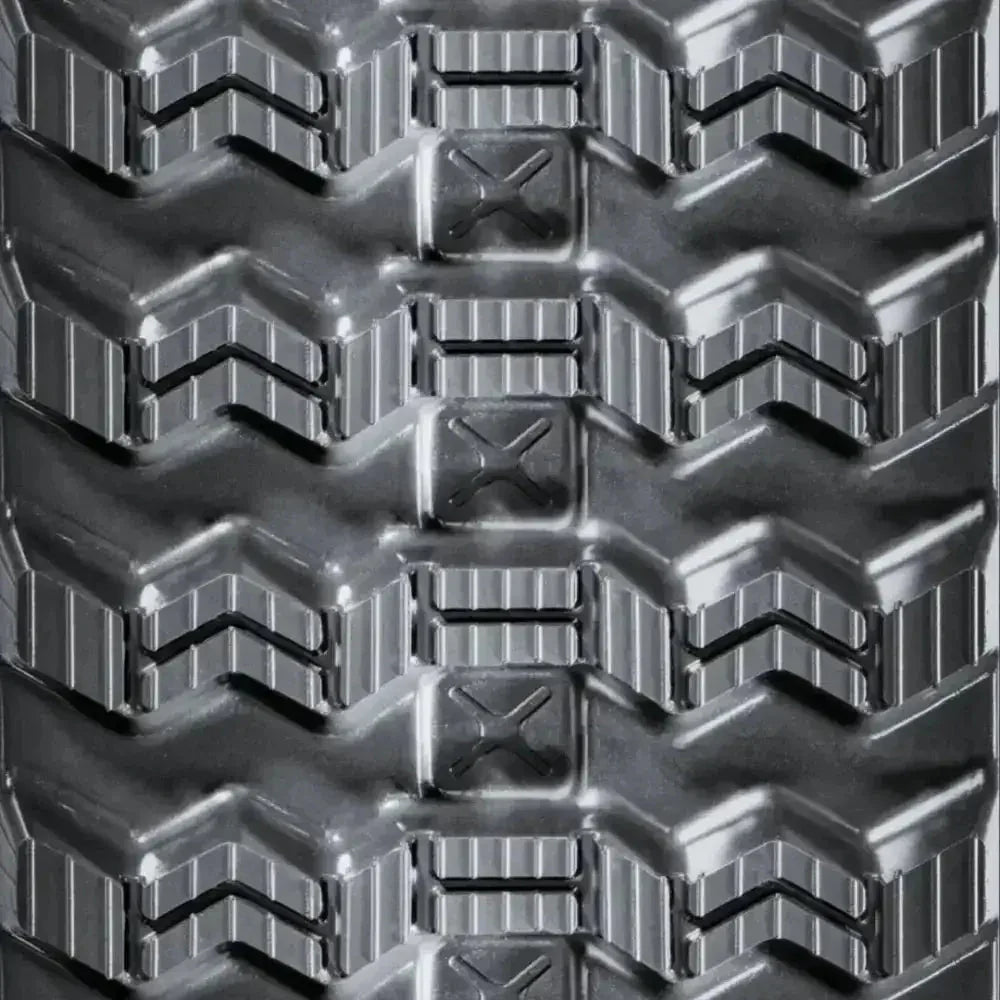 Heavy-duty rubber track with deep textured tread and chevron patterns for New Holland C332