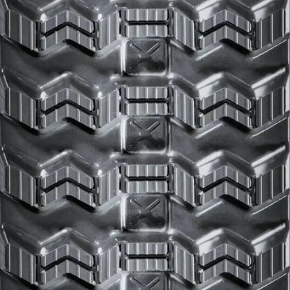 Heavy-duty rubber track with deep textured tread and chevron patterns for New Holland C332