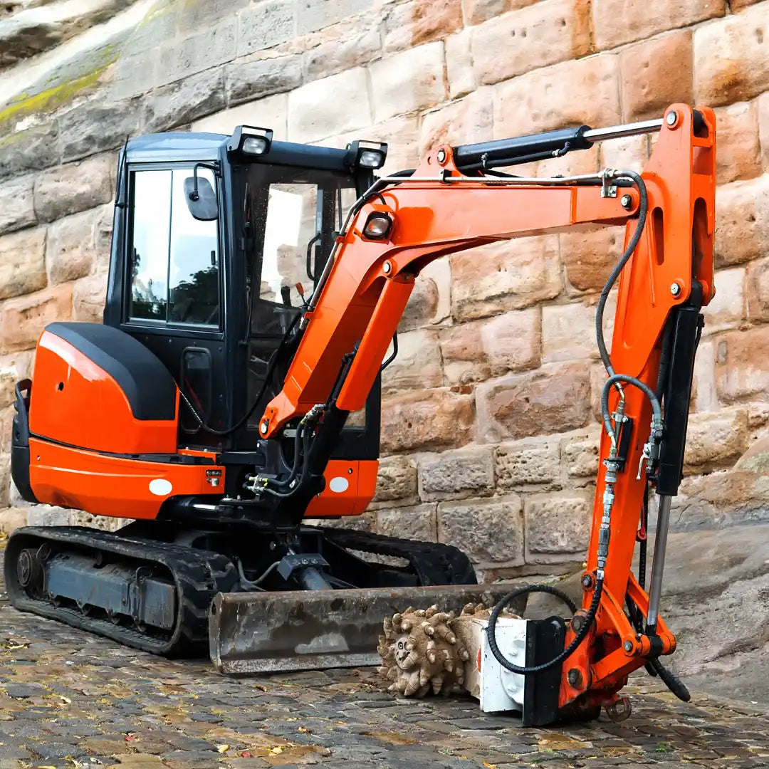 Orange Kubota excavator with new rubber tracks