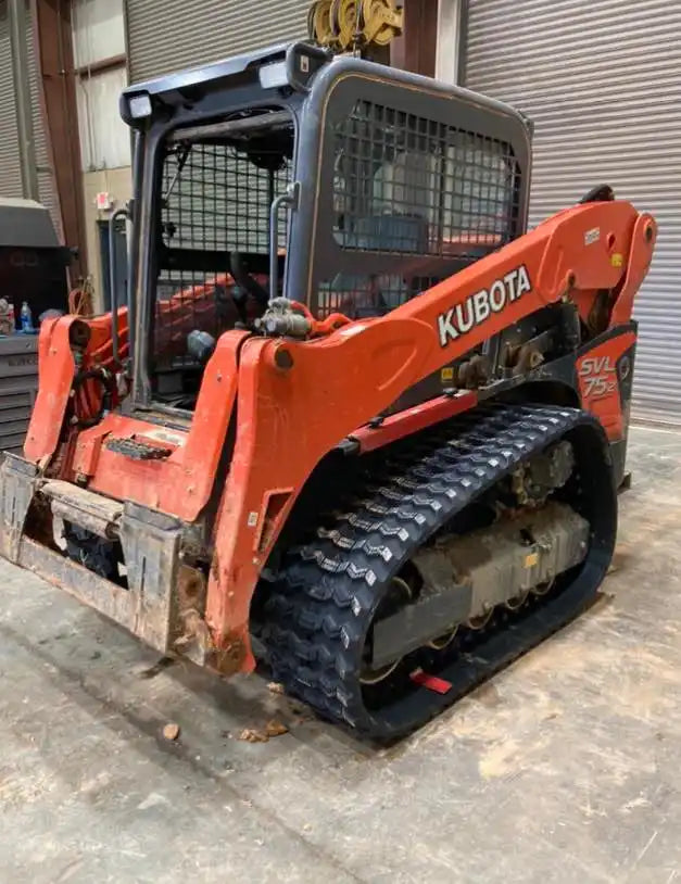 Orange Kubota compact track loader with rubber tracks.