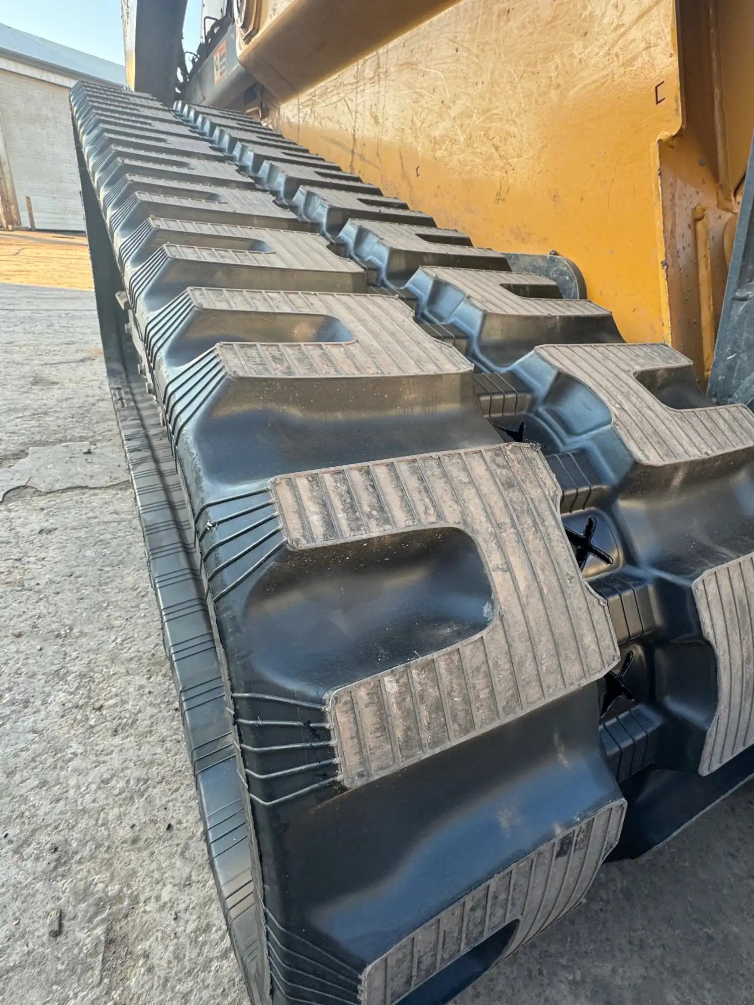 John Deere 333G compact track loader with new 18-inch C-Block rubber tracks installed