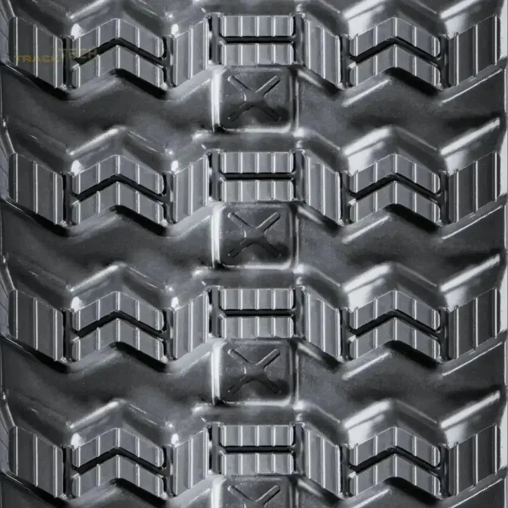 Heavy-duty rubber track with chevron tread pattern and rectangular lugs for Takeuchi TL10V2