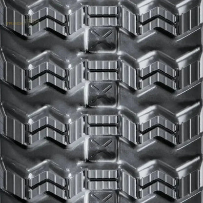 Heavy-duty rubber track with chevron tread pattern and rectangular lugs for Takeuchi TL10V2