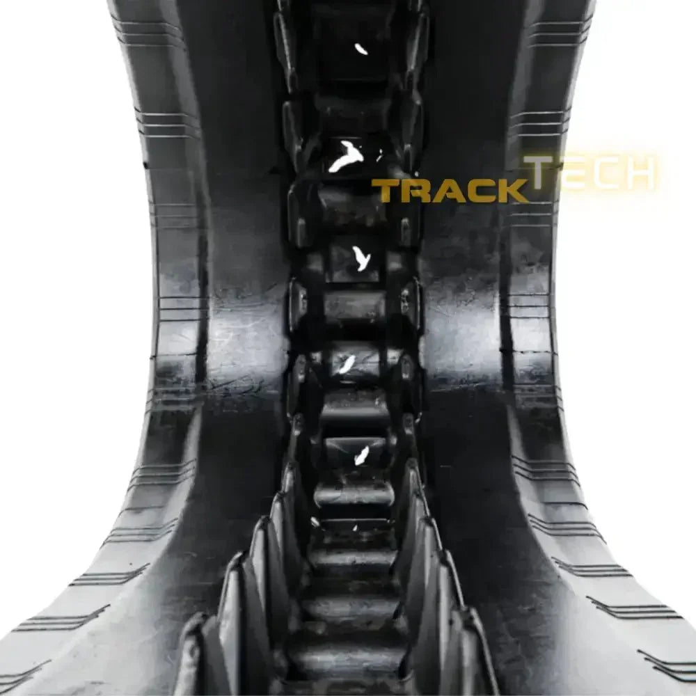 Heavy-duty black rubber track with a distinct tread pattern for Takeuchi TL250 excavator